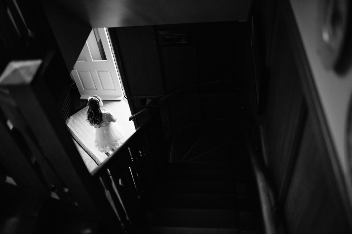 view of Flower girl from stairs Burnside Church Martinborough Wedding black and white