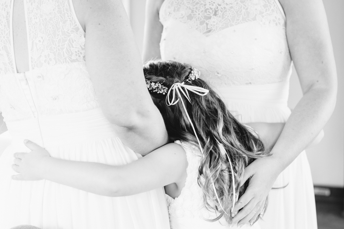 flower girl hugging bridesmaids Riversdale Wedding natural light black and white